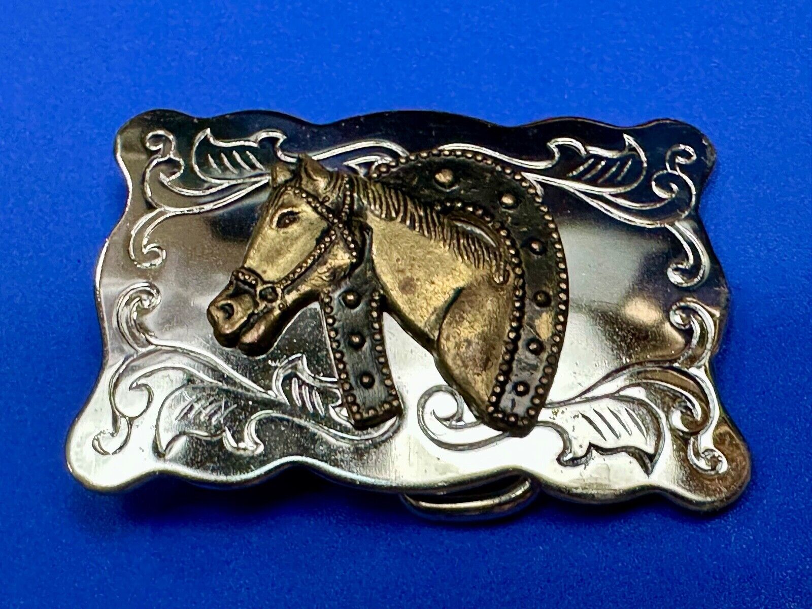 Vintage lucky horseshoe with head centerpiece on western two tone belt buckle