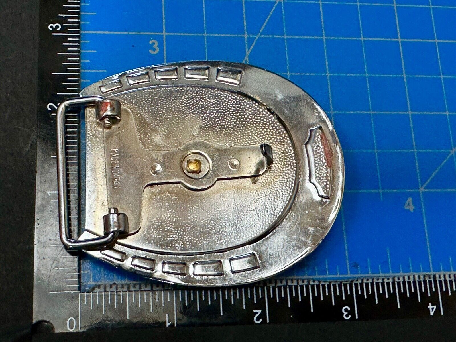 Artisan Resin covered Horseshoe shaped Belt Buckle with gold tone standing horse