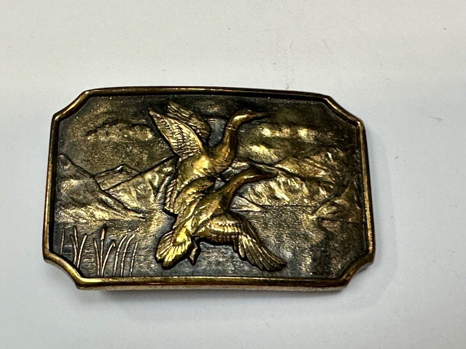 Two ducks flying from pond cat tails Nature Solid Brass belt buckle by BTS