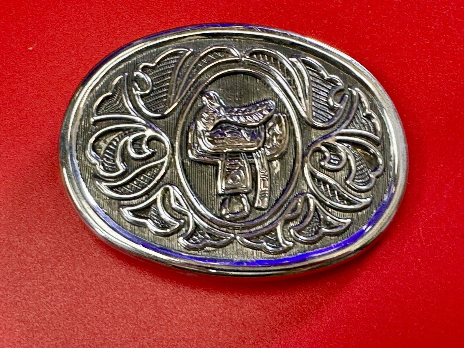Vintage Cowboy's Horse Saddle ornate flower swirl oval belt buckle by Avon