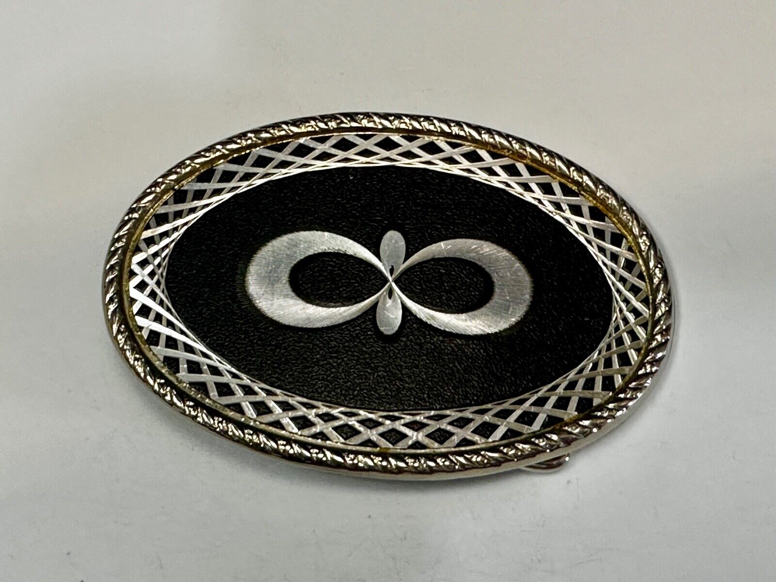 Vintage etched Figure 8 pattern on two tone Black & Silver Belt Buckle