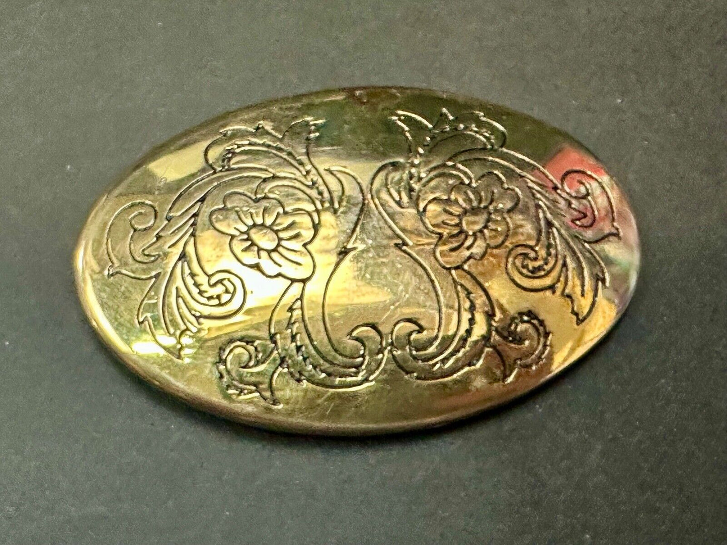 Antique? Engraved flower swirl pattern on gold color oval belt buckle