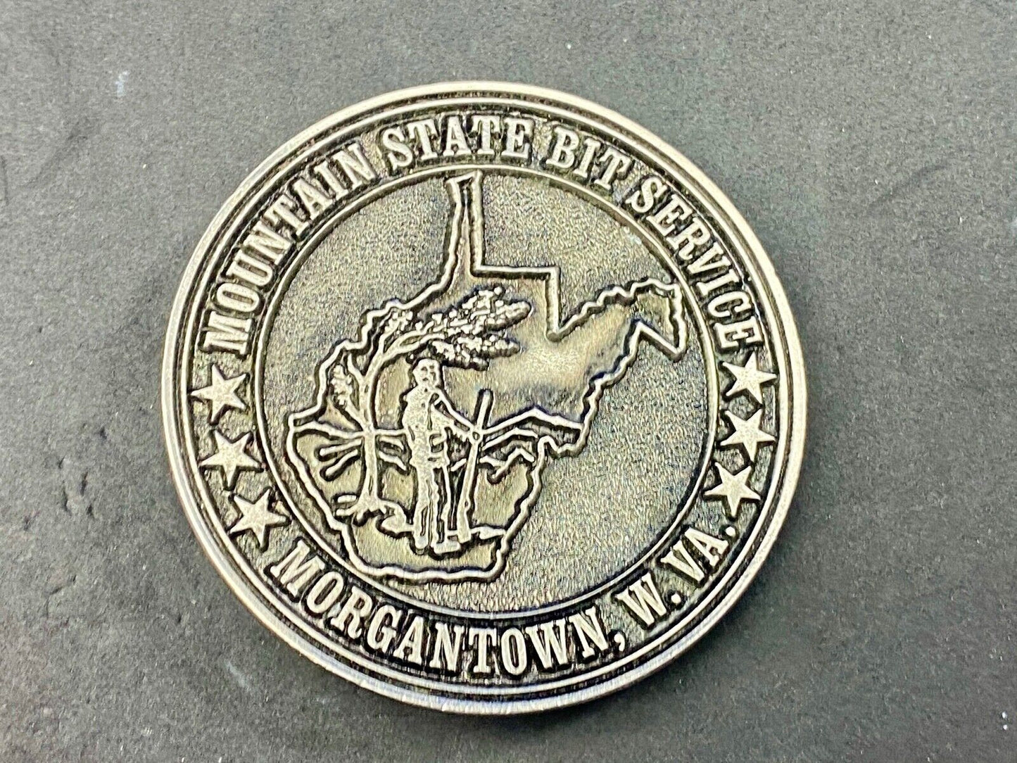 Vintage  Mountain State Bit Services Morgantown W.V. round belt buckle  by Lewis