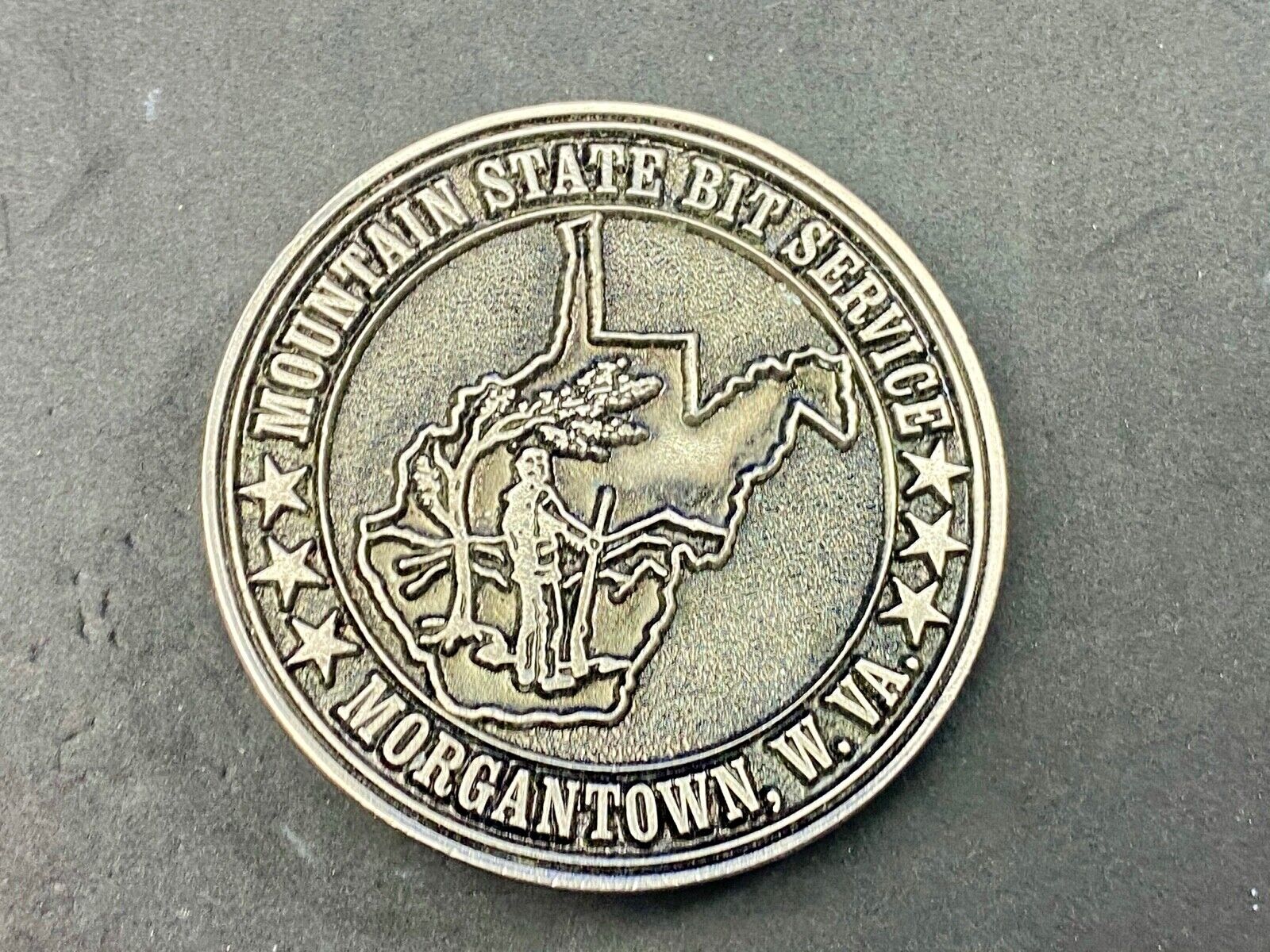 Vintage  Mountain State Bit Services Morgantown W.V. round belt buckle  by Lewis