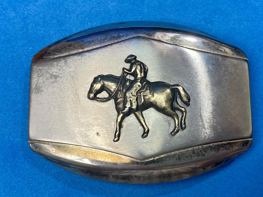 Vintage belt buckle Horseback old west cowboy riding the trail 