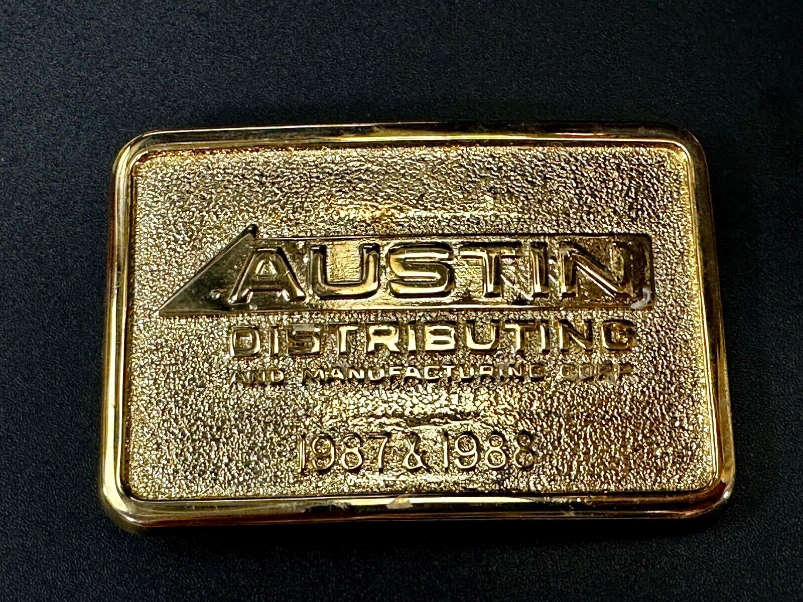 Austin Texas Distributing and Manufacturing 1987 Gold Tone Belt Buckle