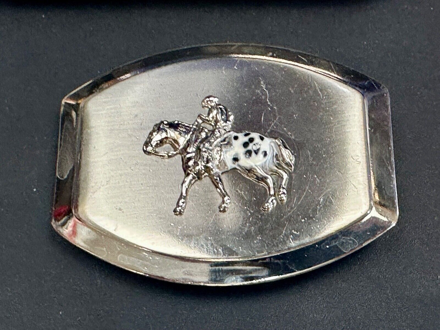 Vintage Horseback Riders cowboys belt buckle with black & white enamel accents