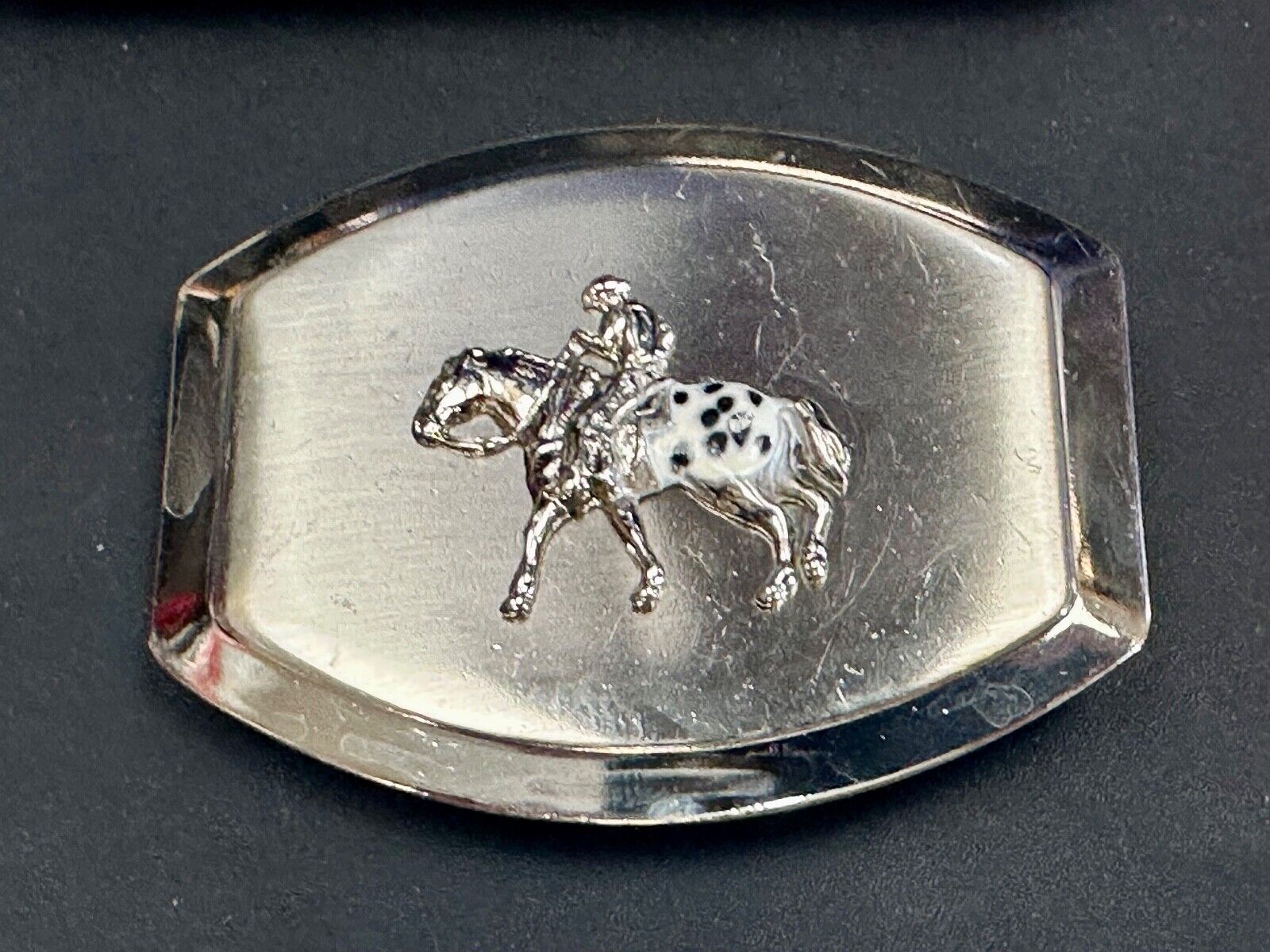 Vintage Horseback Riders cowboys belt buckle with black & white enamel accents