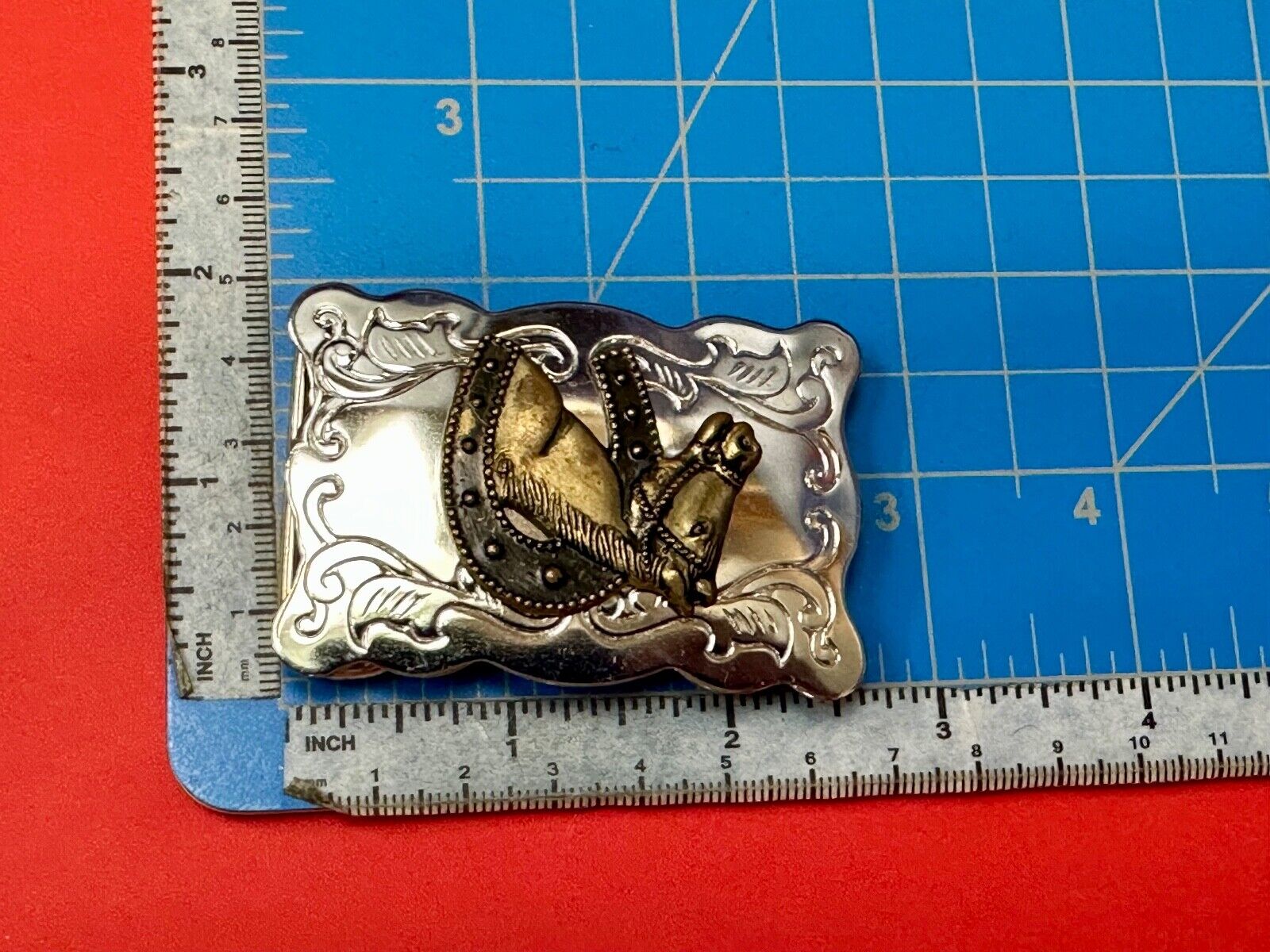 Vintage lucky horseshoe with head centerpiece on western two tone belt buckle