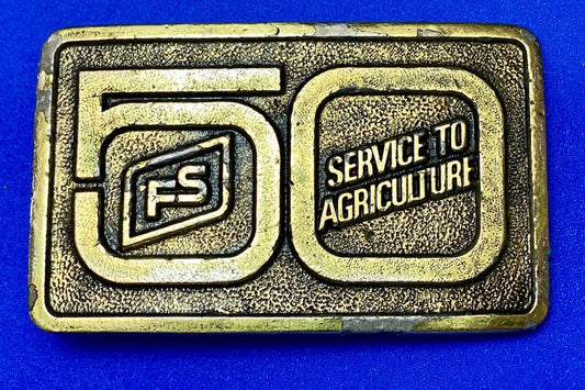 50 years, Farm Service to Agriculture belt buckle by Wyoming Studio Art works