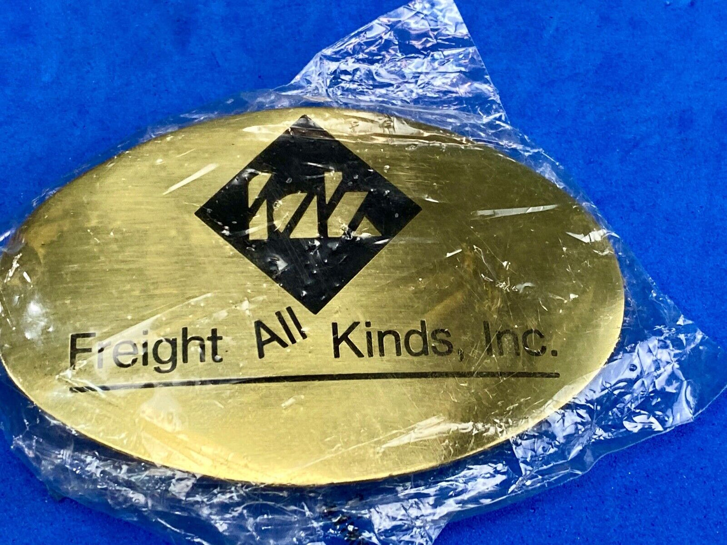 Vintage Freight all kinds, INC. promotional brass belt buckle 