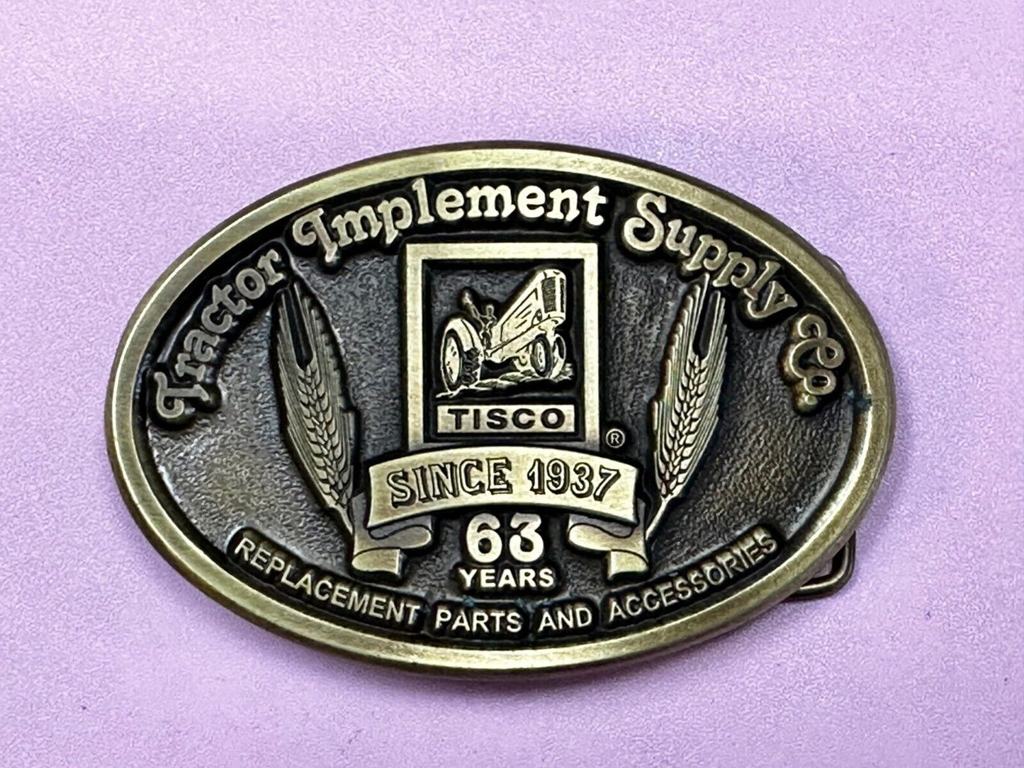 63 years TISCO Tractor Implement Supply company Vintage Belt Buckle by Speccast
