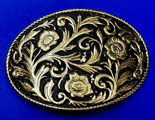 Vintage black and gold tone western flower floral theme cowboys belt buckle