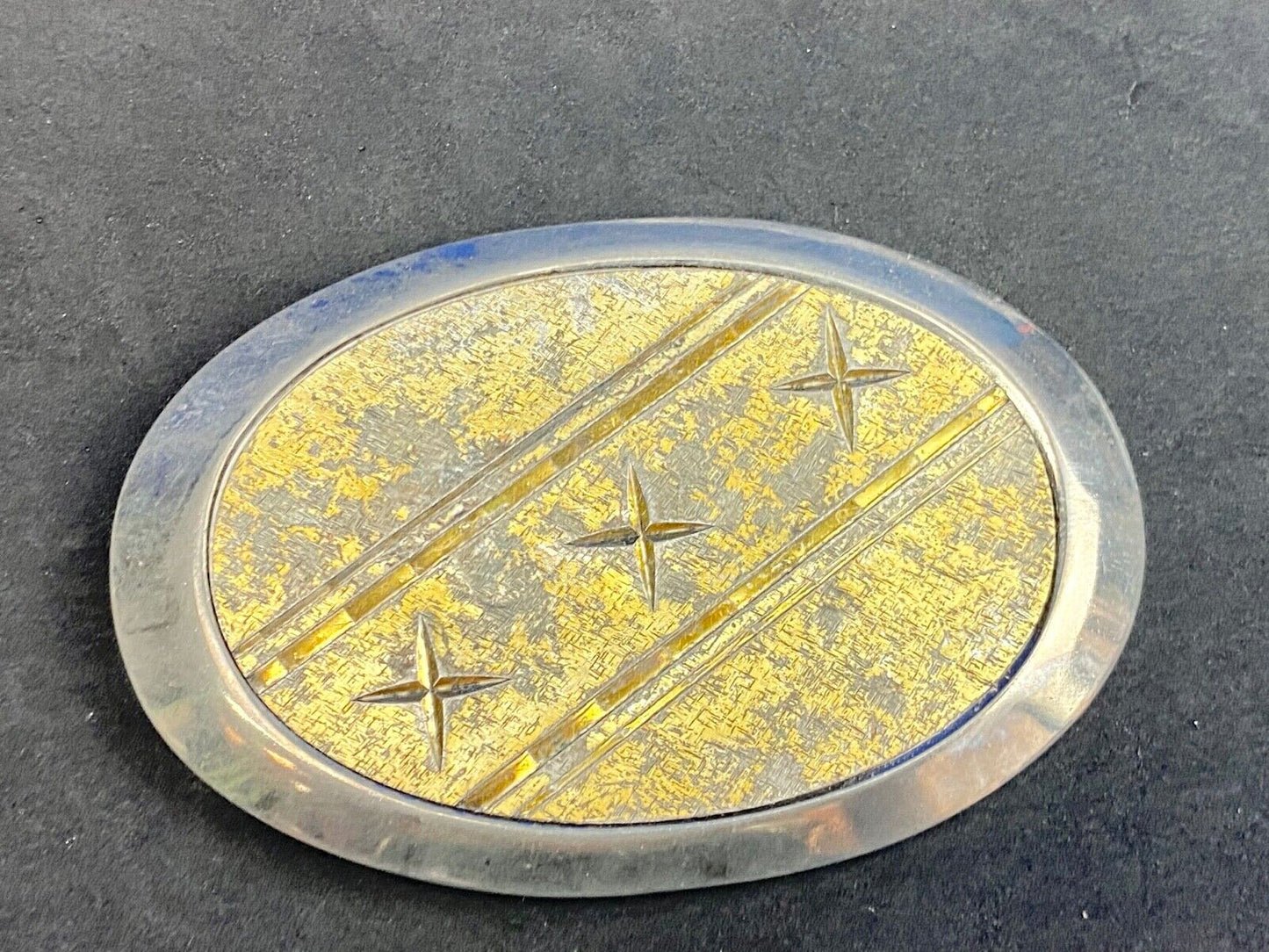 Unique XXX gold tone belt buckle tic tac toe pattern