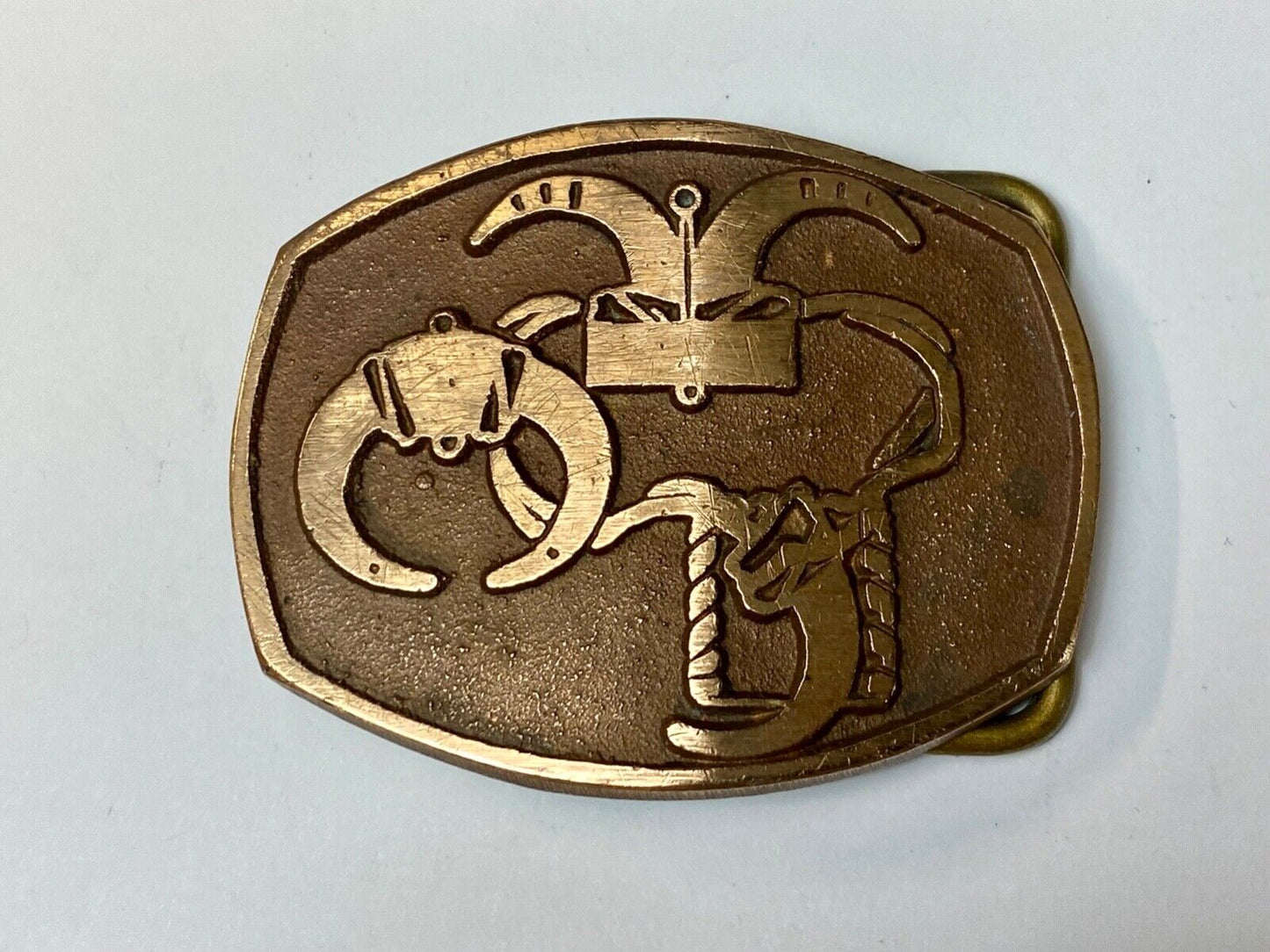 unknown to me - cattle branding symbols? longhorn western? belt buckle