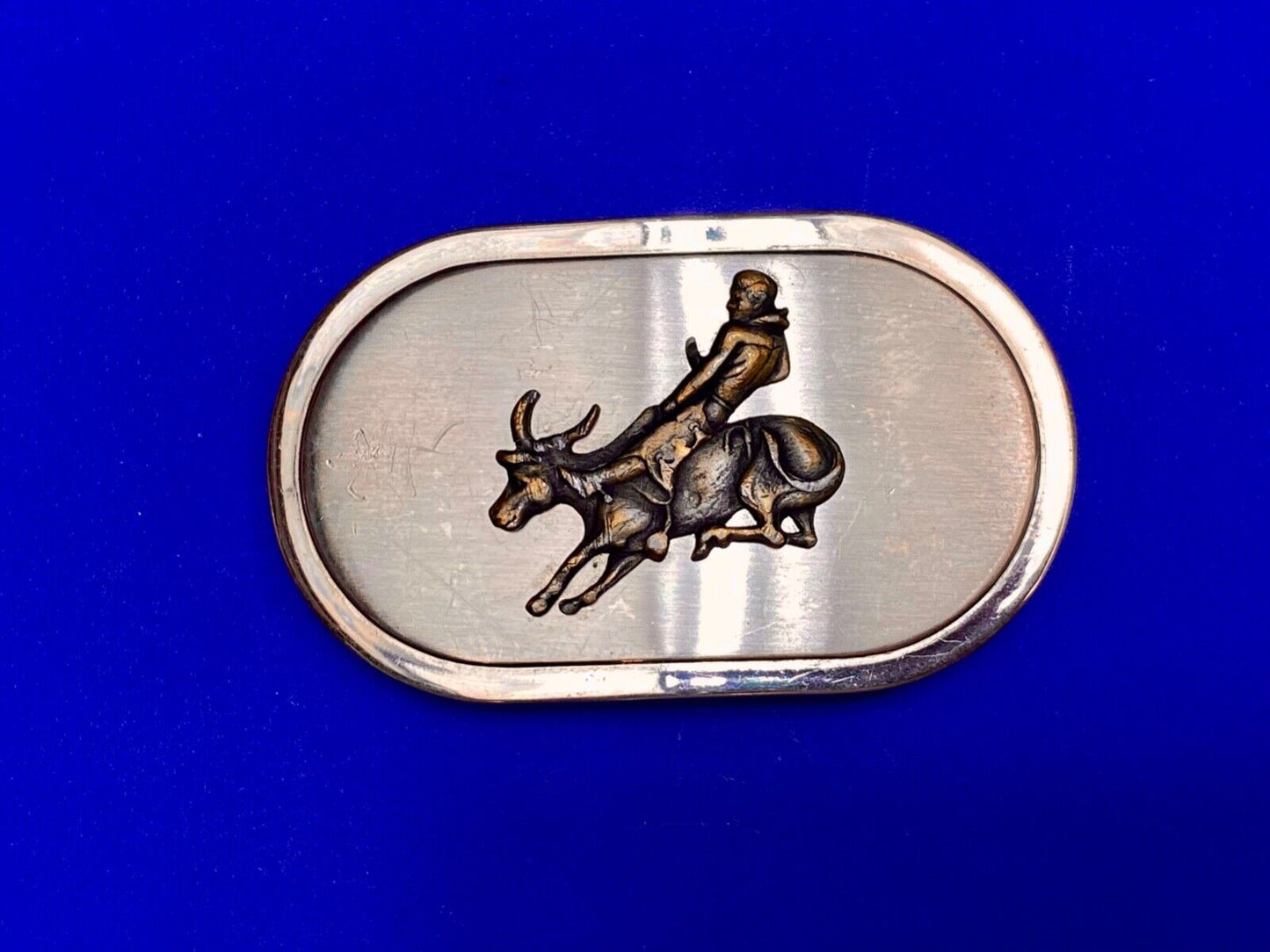 Vintage western oval Rodeo Cowboy on bucking bronc? bull numbered belt buckle
