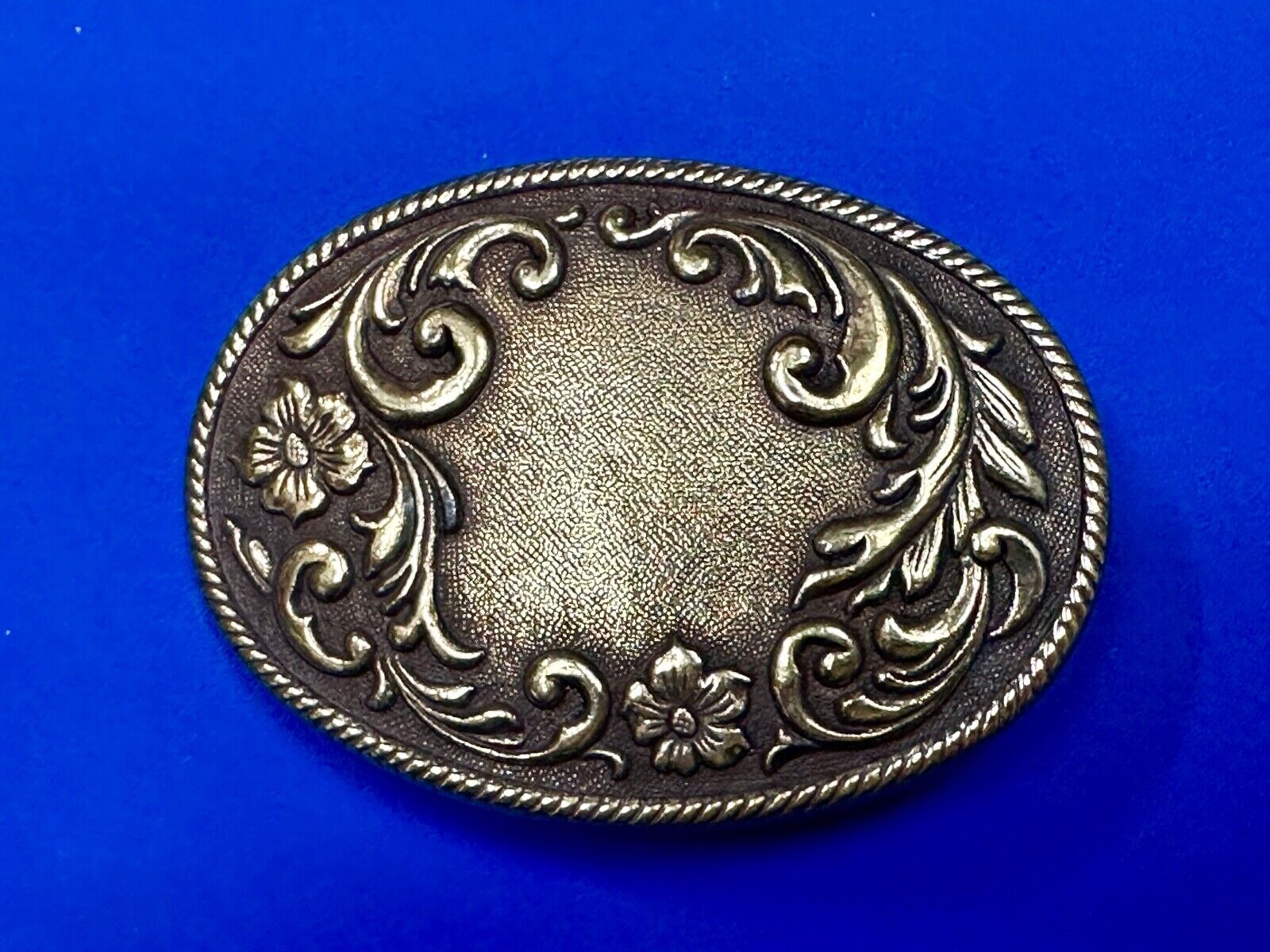 USA made vintage western flower swirl design oval belt buckle marked W