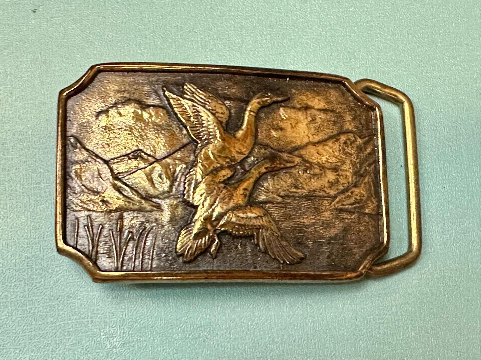 Two ducks flying from pond cat tails Nature Solid Brass belt buckle by BTS