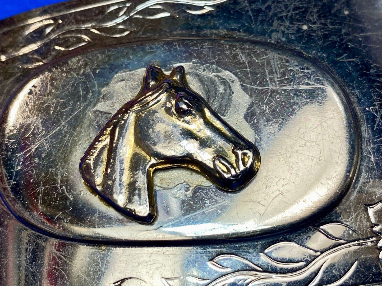 Vintage horse head on western belt buckle