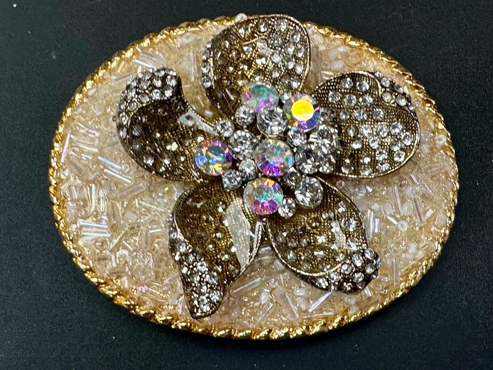 Beautiful chunky goldtone flower centerpiece in rhinestone accented belt buckle