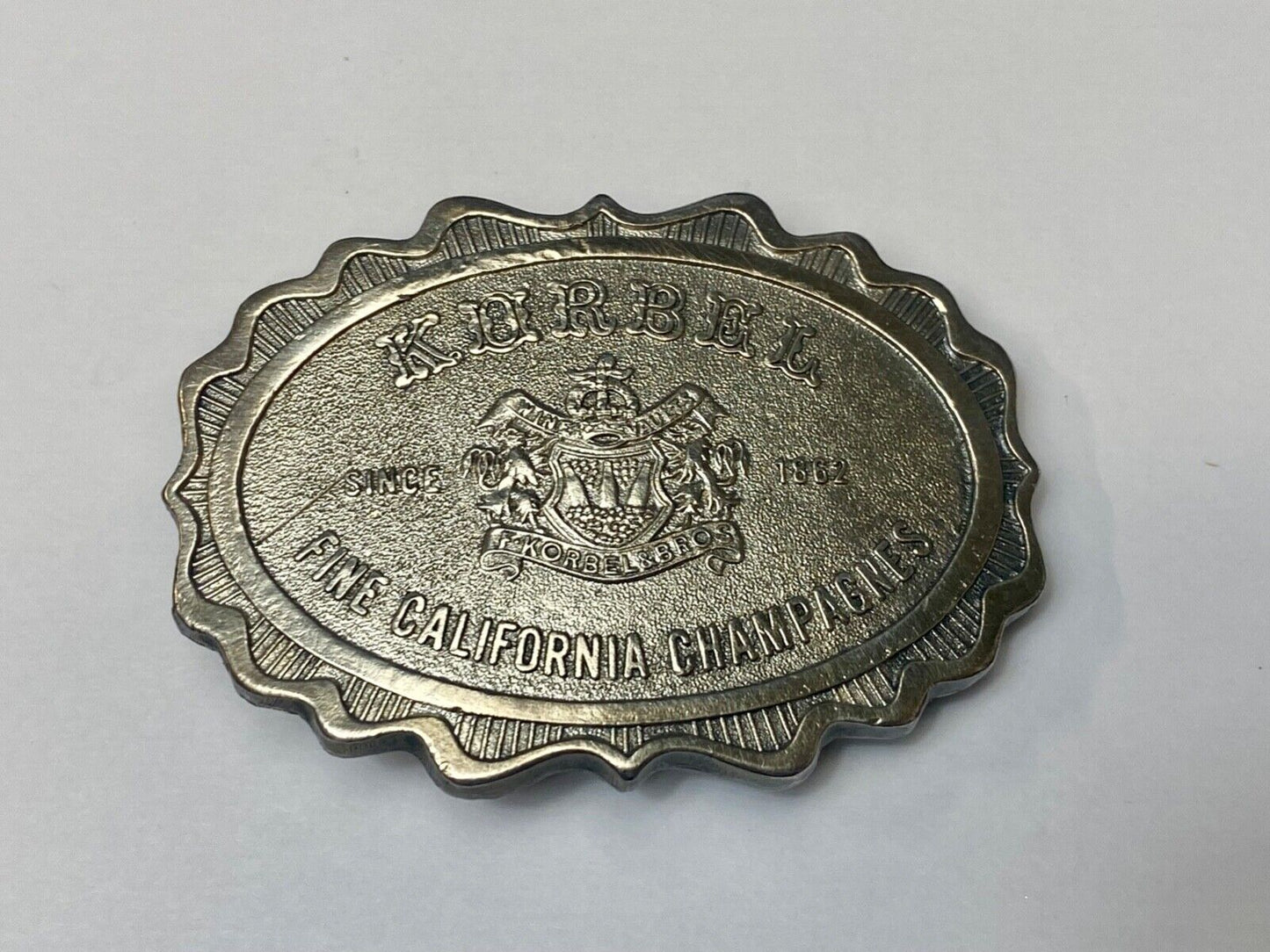 vintage Korbel Fine California champagne belt buckle by Wyoming Studio Art