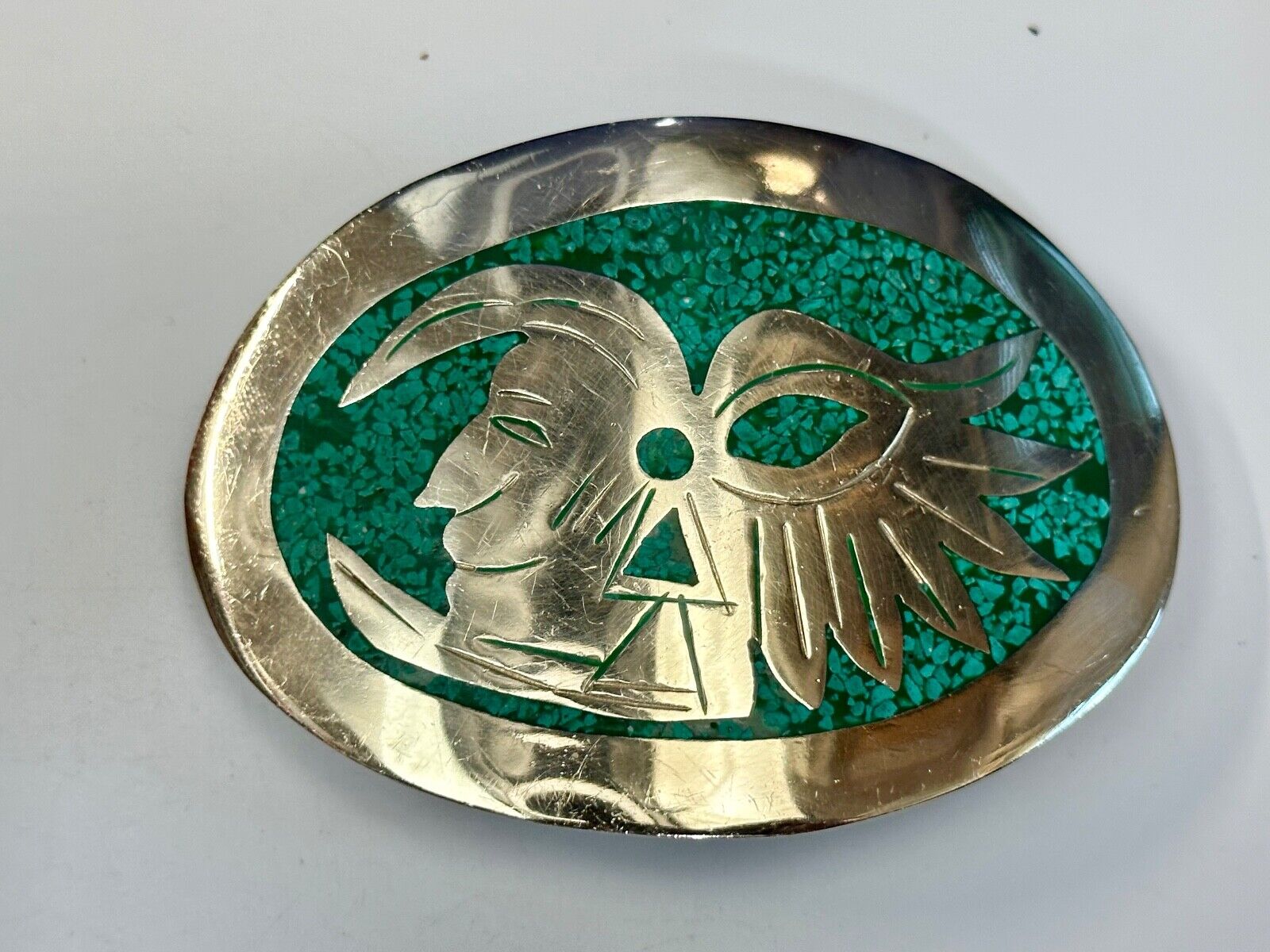 Tribal Face - Inlaid Turquoise chip to Alpaca stamped oval Belt Buckle