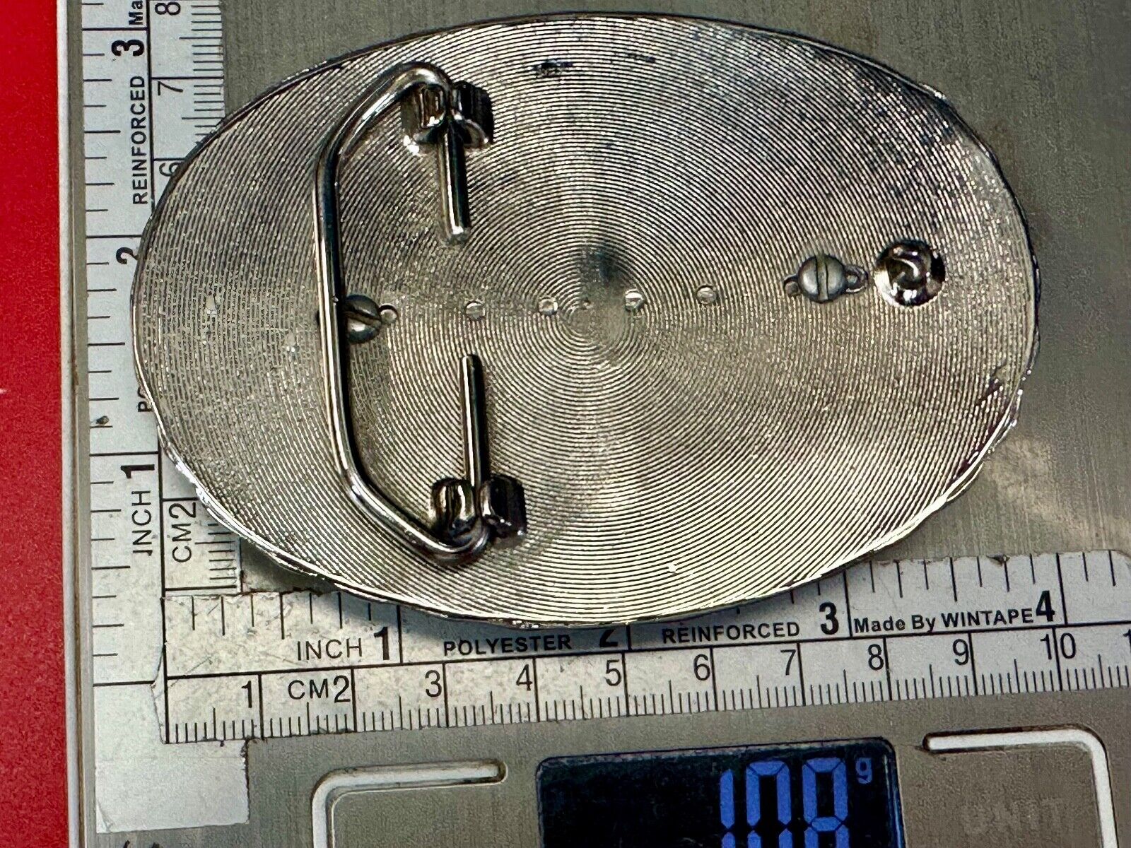 Two lucky pennies coins encased in cab style centerpiece of western belt buckle