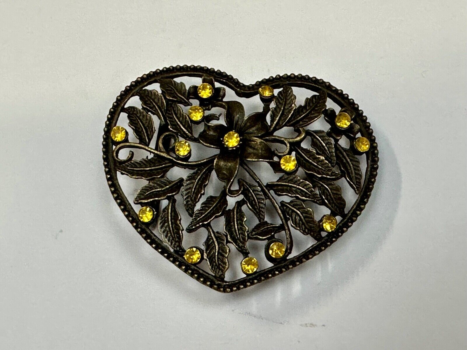 Beautiful see through Heart shaped belt buckle with yellow rhinestone accents