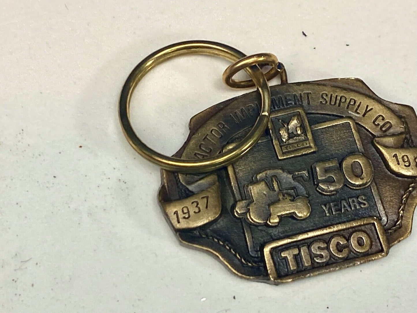 TISCO Tractor Implement Supply Co 50 year celebration NOS Keychain 