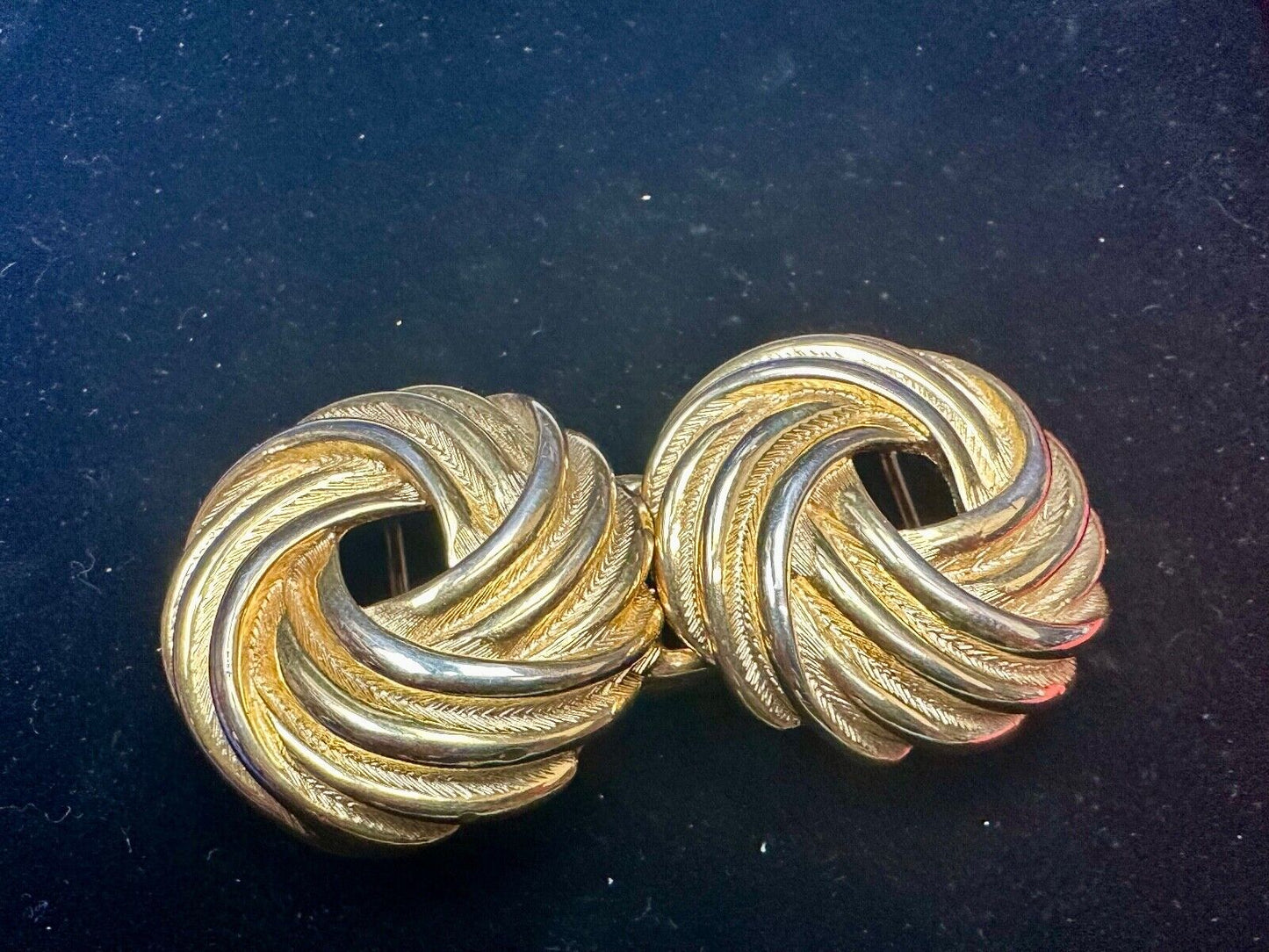 Two piece Round Swirl Interlocking gold color belt buckle by Douglas Paquette