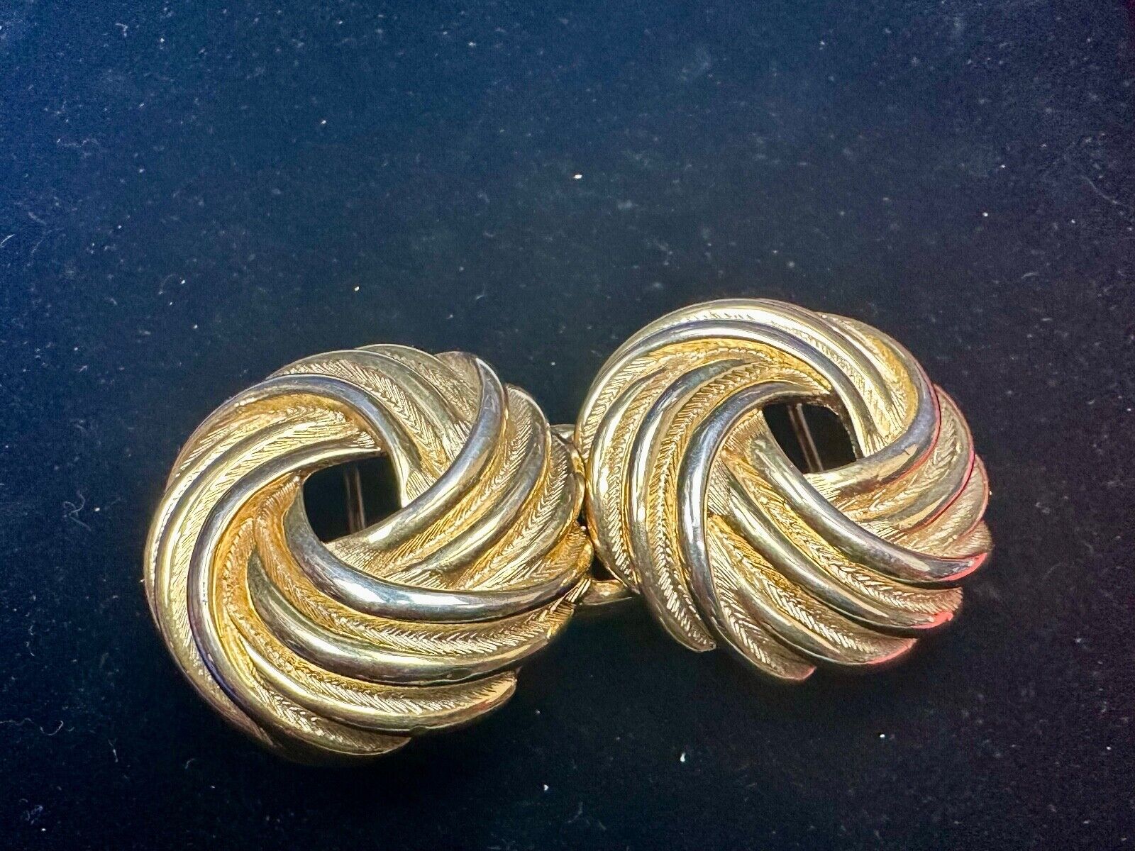 Two piece Round Swirl Interlocking gold color belt buckle by Douglas Paquette