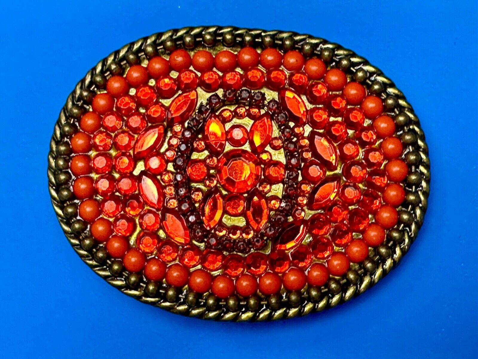 Unique Shades of Red - Mixed Materials oval outlined Belt Buckle