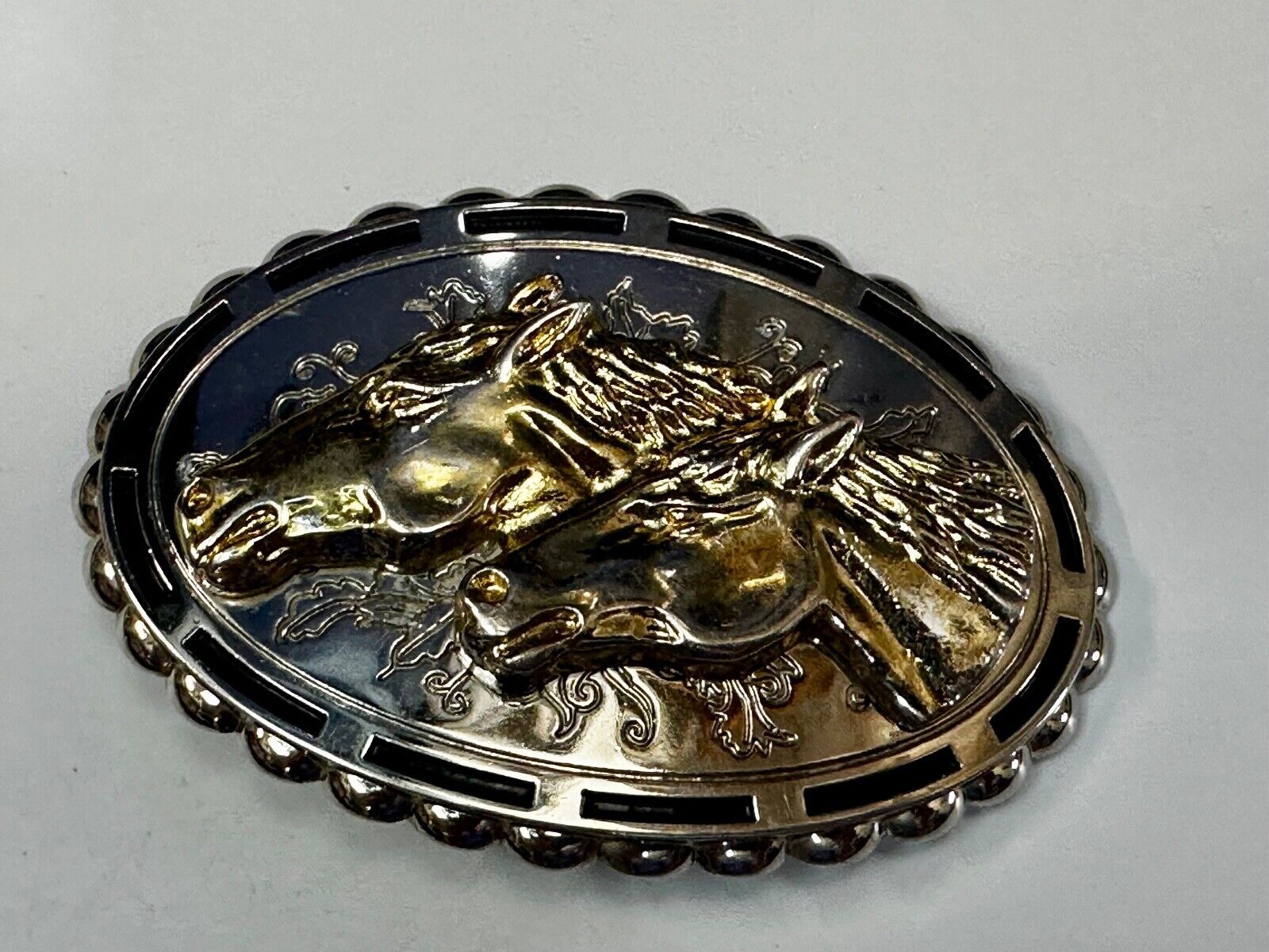 Two horse heads - Vintage two tone oval Belt Buckle with reflective backing