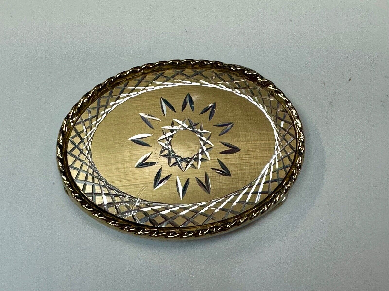 vintage gold tone starburst design oval belt buckle marked W