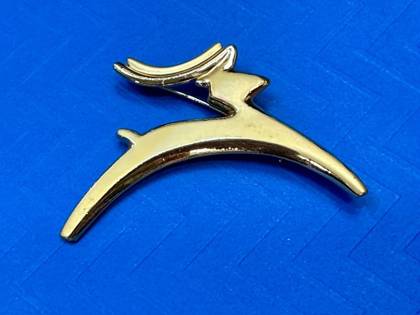 Abstract gold tone running deer - Vintage Christmas Holliday Brooch by AJC