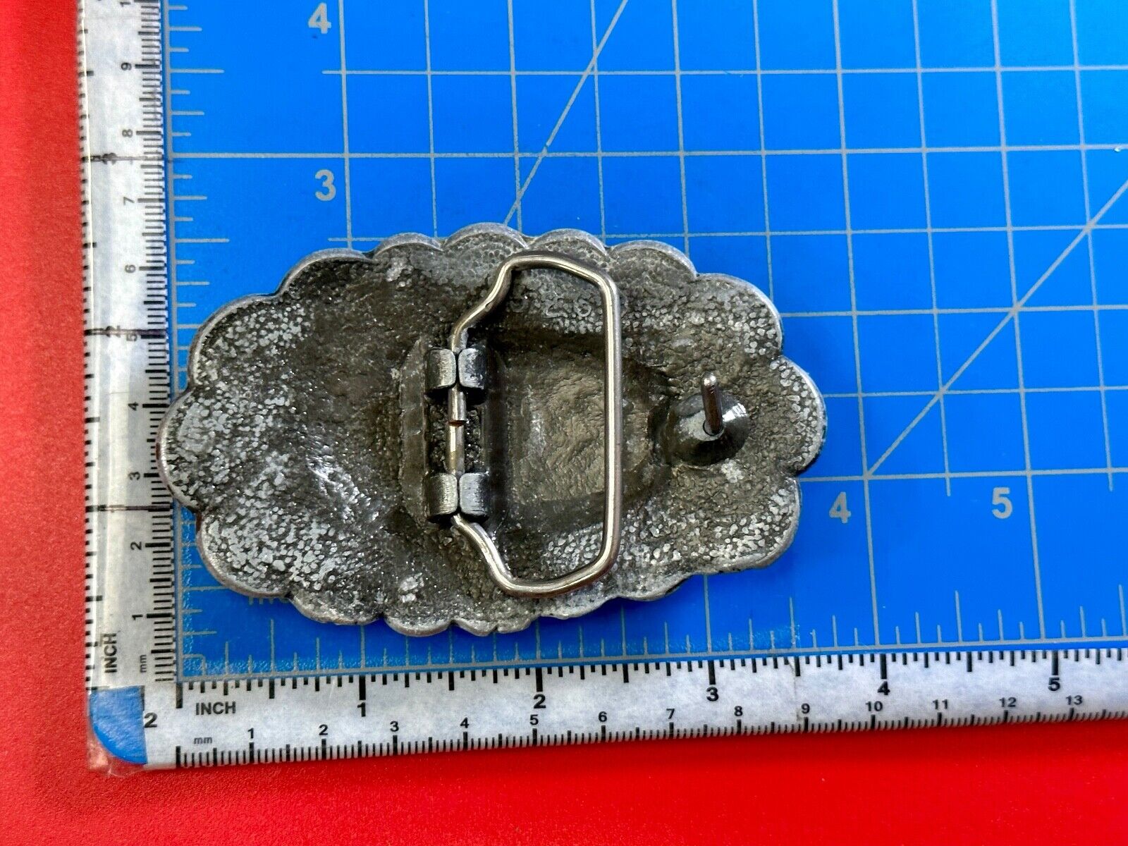 Turquoise stone centered on Vintage metal flower theme belt buckle