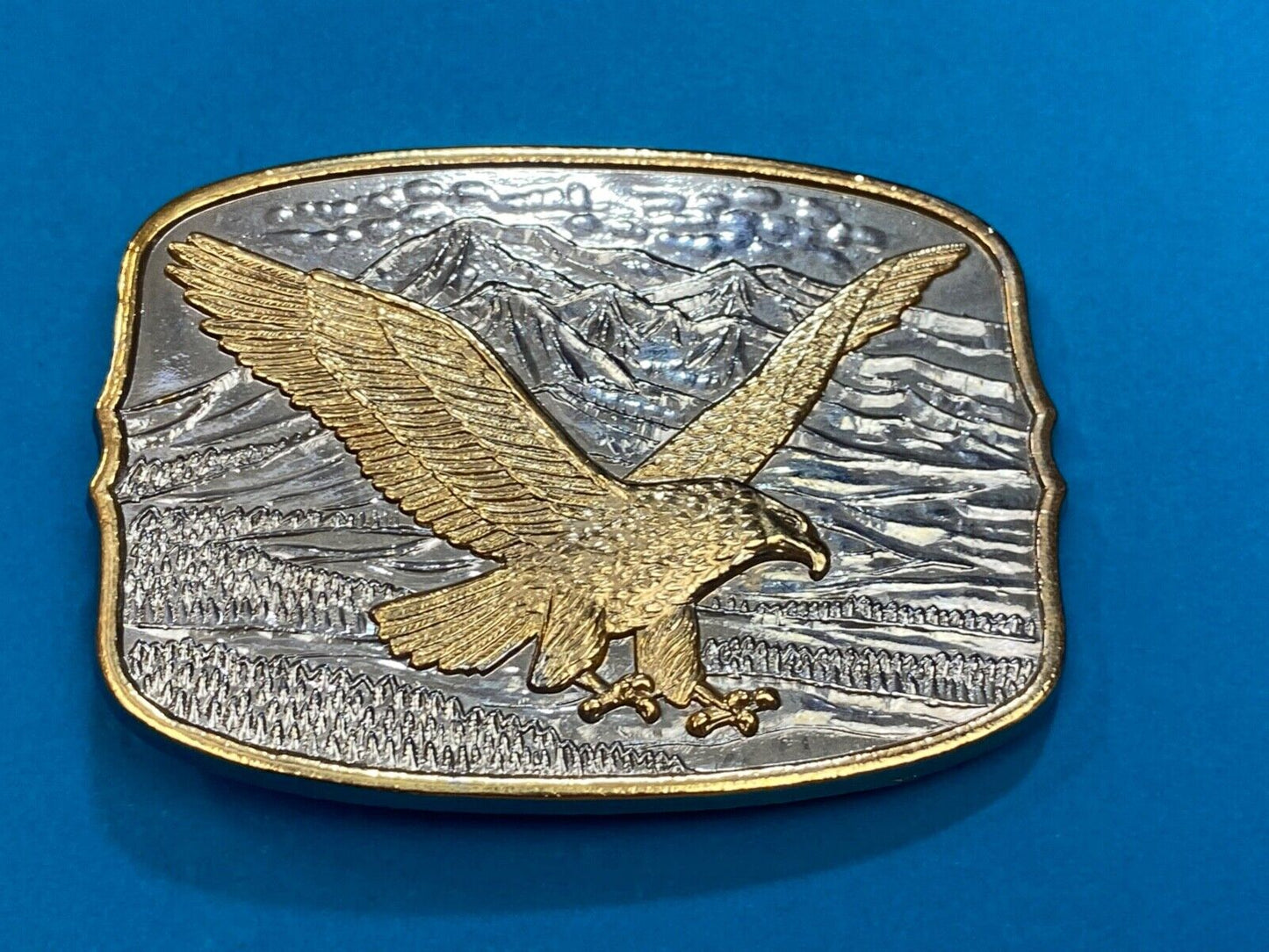 AMERICAN EAGLE Majestically hunting flying over mountains Numbered belt buckle