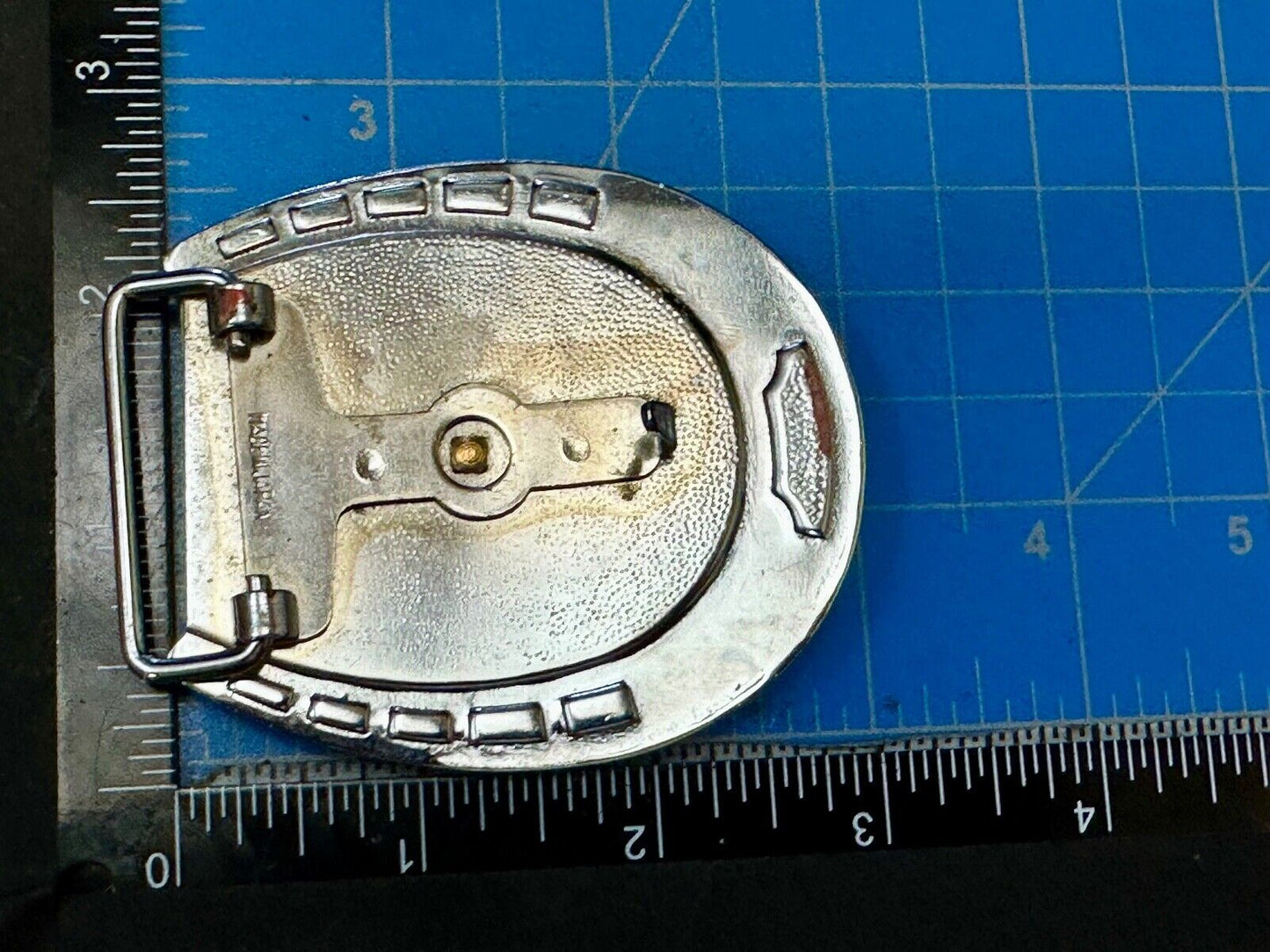 Artisan Resin covered Horseshoe shaped Belt Buckle with gold tone standing horse