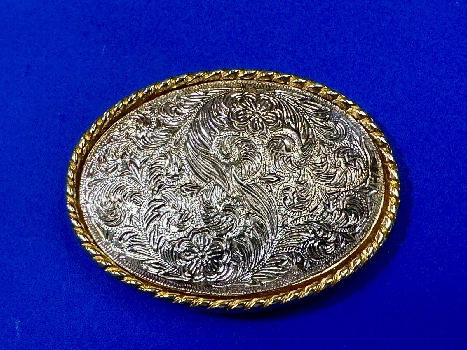 vintage Ivan Brand western flower swirl design two tone oval belt buckle