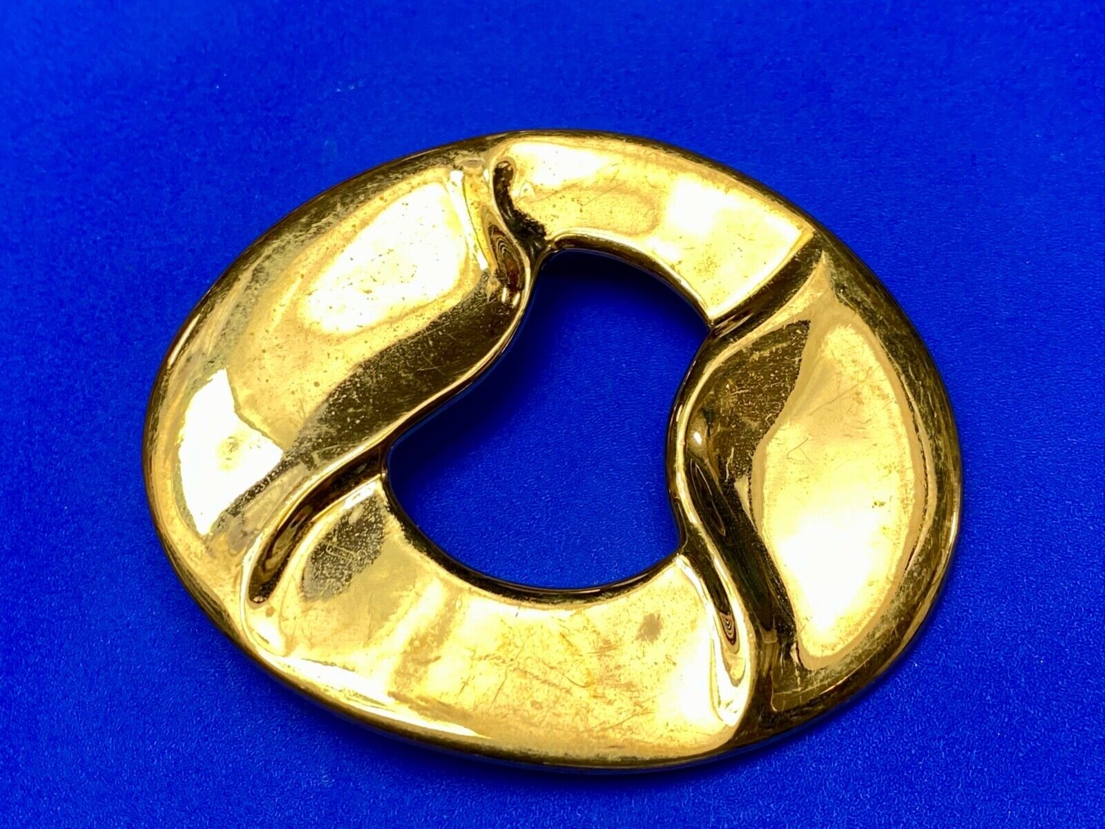 Artist Ginnie Johansen signed gold color abstract oval belt scarf slide