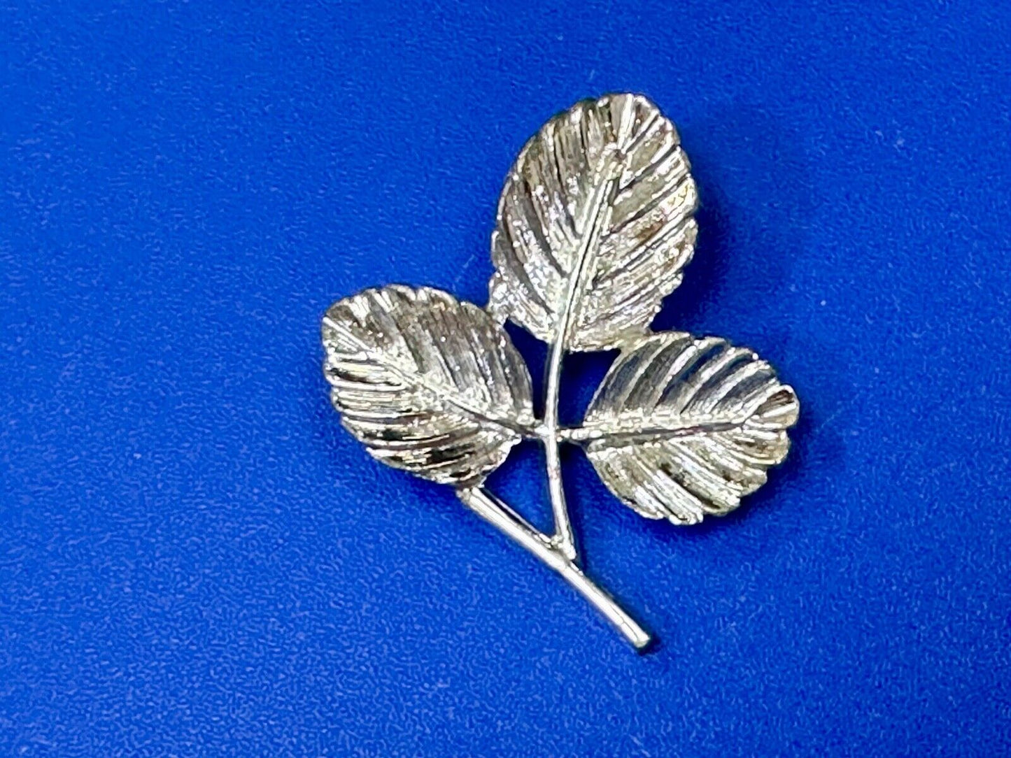 Three Leaf cutout Sarah Coventry signed silver tone brooch pin