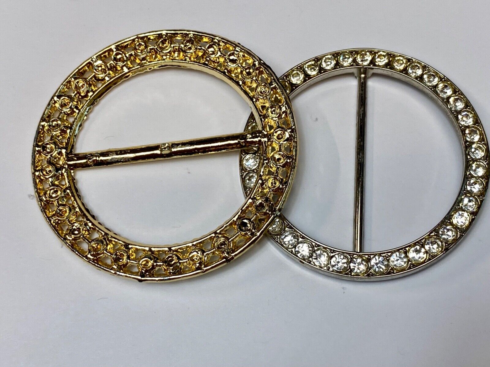 Two piece lot of antique Rhinestone covered round scarf slides