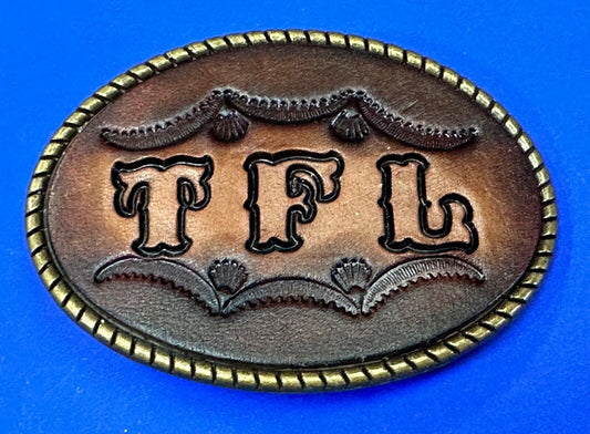 TFL.  vintage western initials letters on leather belt buckle