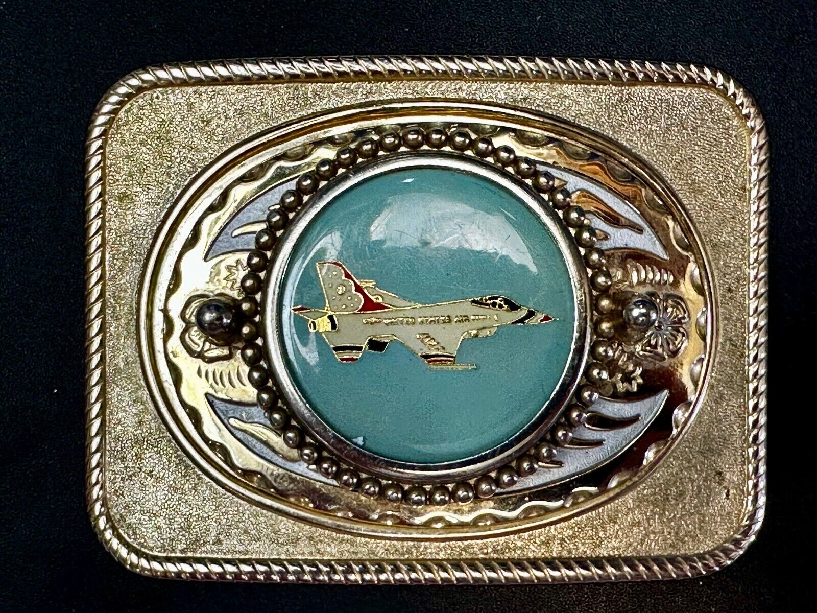 Us Air Force Fighter Jet as centerpiece in western Belt Buckle - or dollar coin