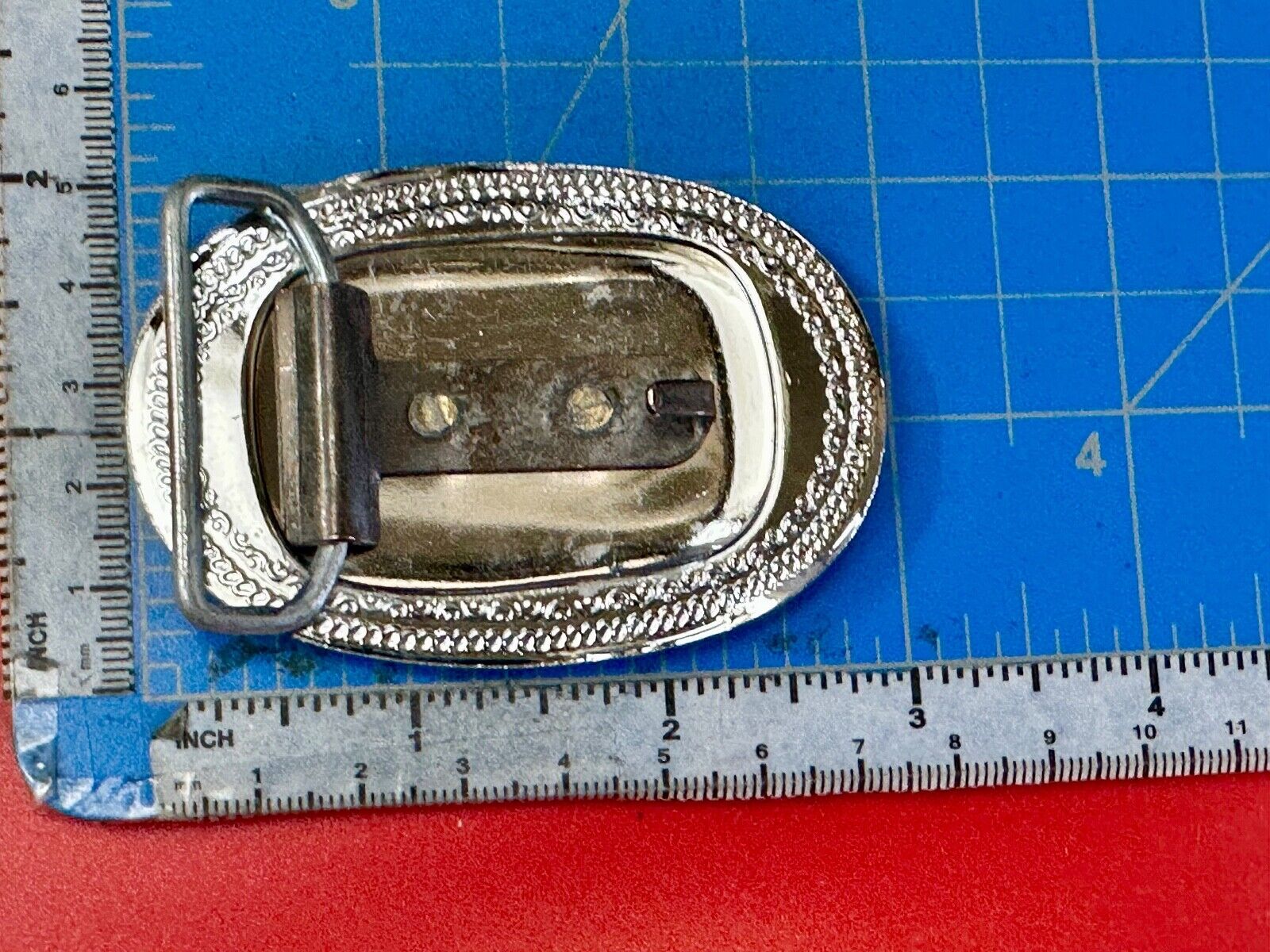 70s Covered Wagon two tone reflective oval ornate boarder belt buckle