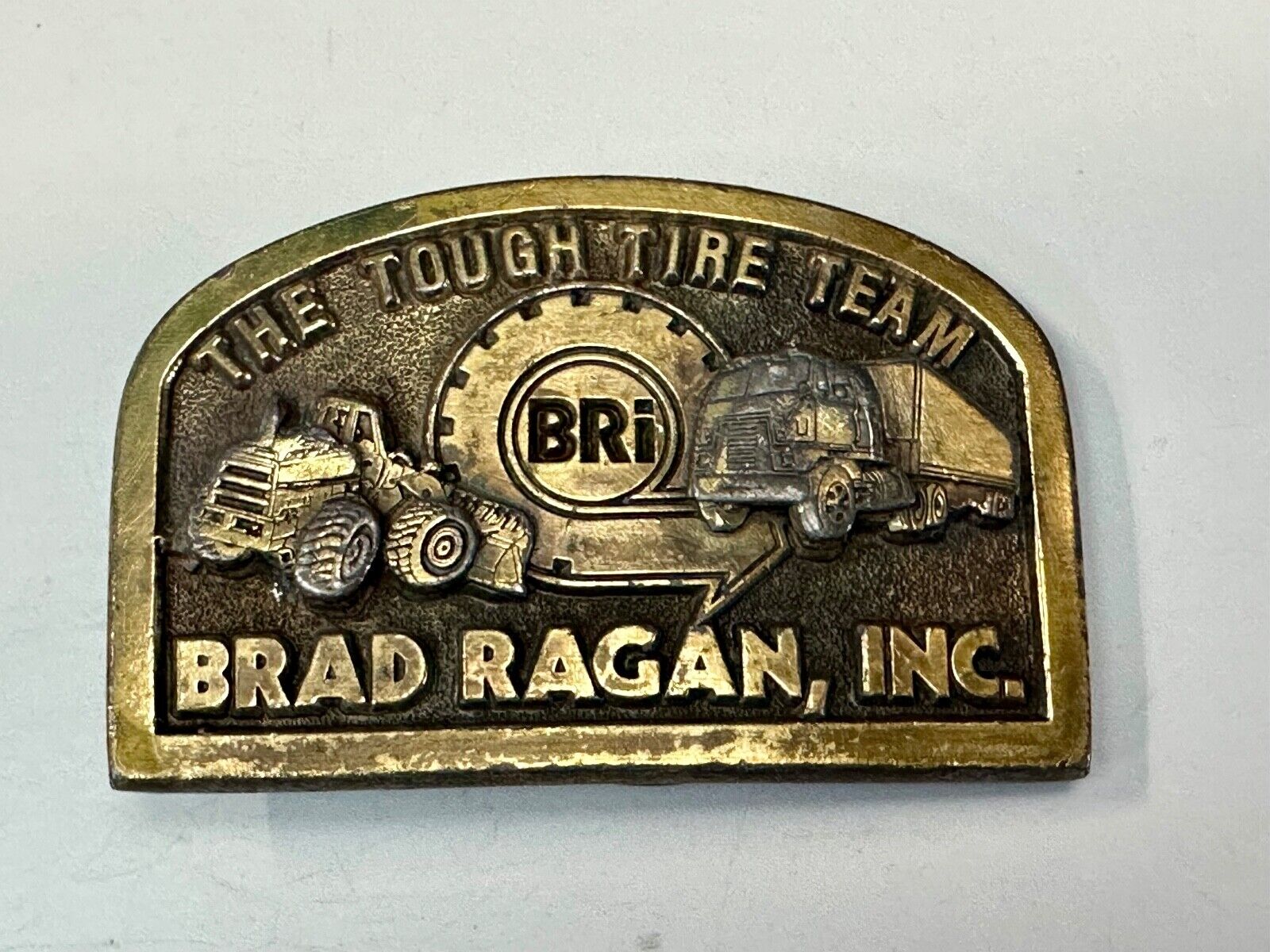 The Tough Tire Team BRi Brad Ragan, Inc. vintage belt buckle by Spec-Cast