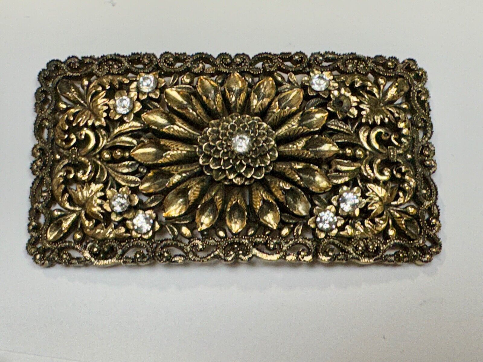 Antique gold tone? Flower theme Rhinestone covered scarf slide belt loupe buckle