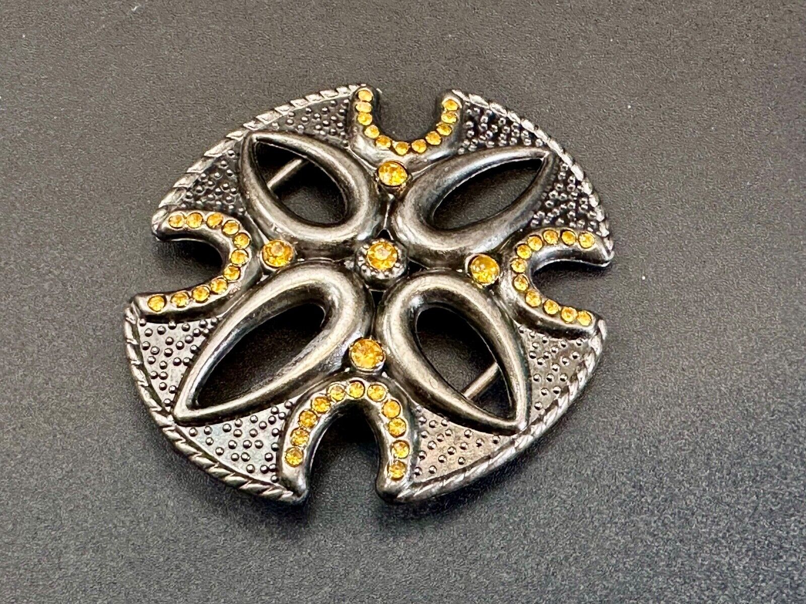 unique see through iron cross with golden brown rhinestone accents