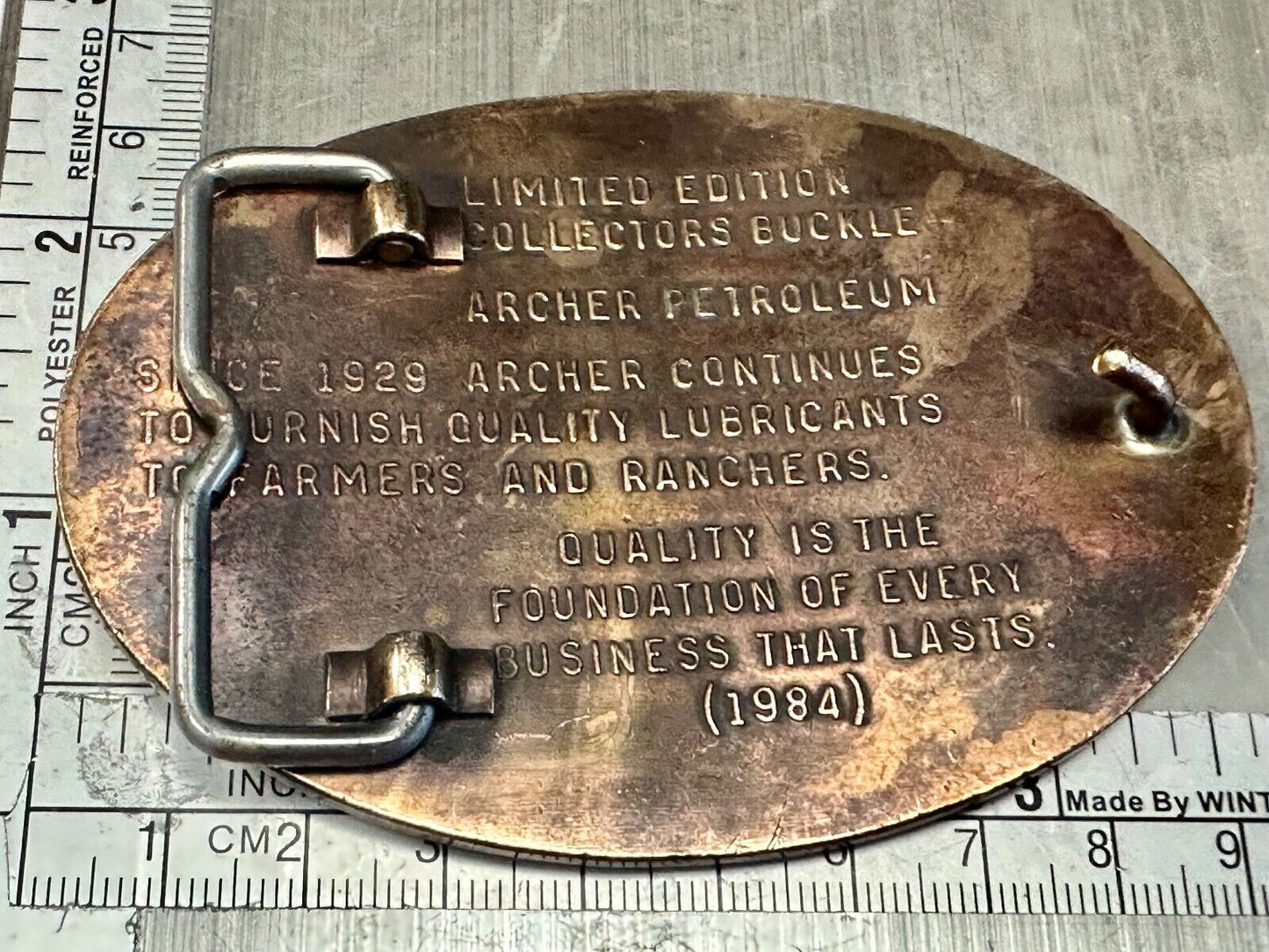 Archer Lubricants Omaha NE - Oil for farmers ranchers belt buckle