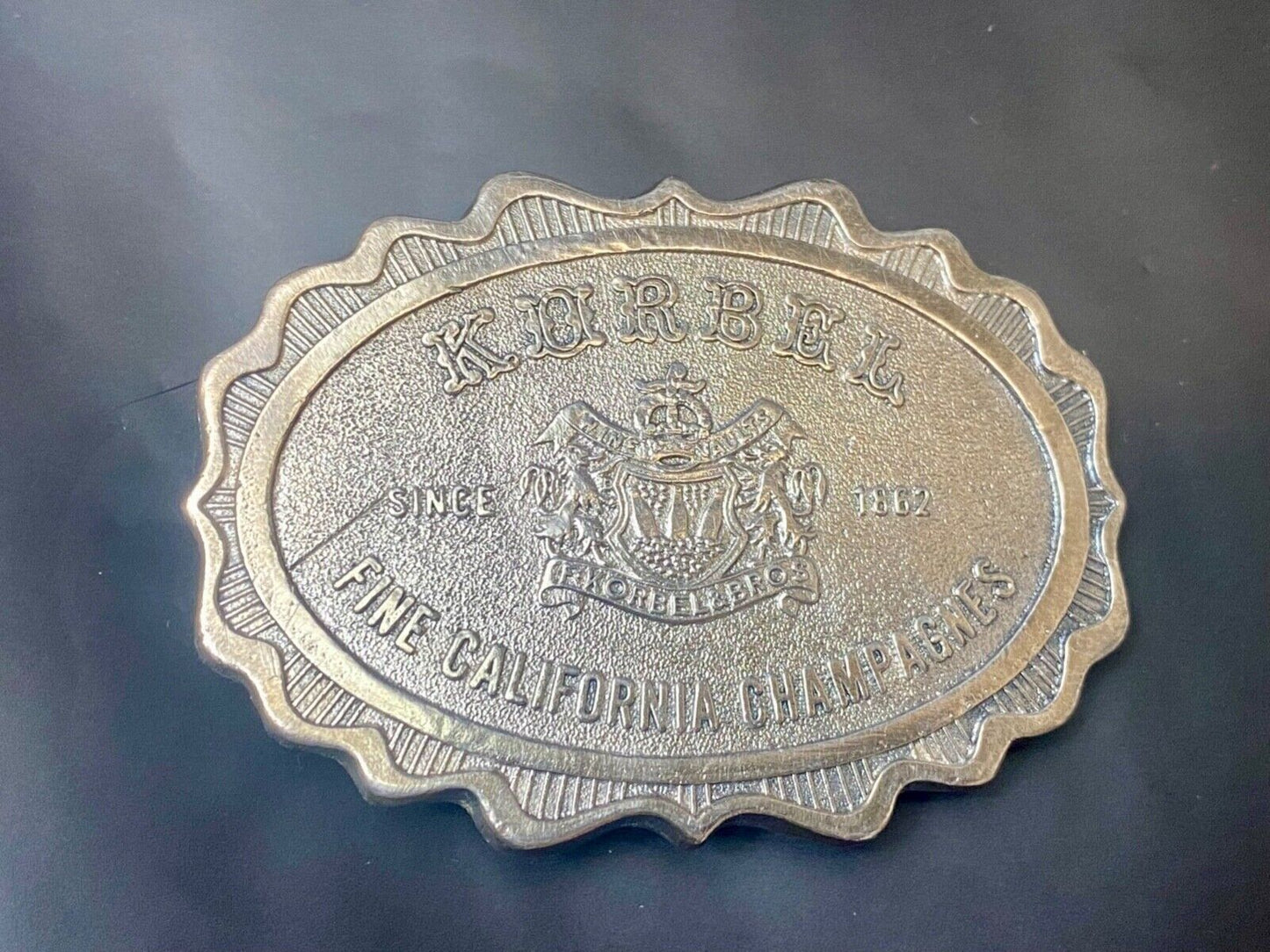 vintage Korbel Fine California champagne belt buckle by Wyoming Studio Art